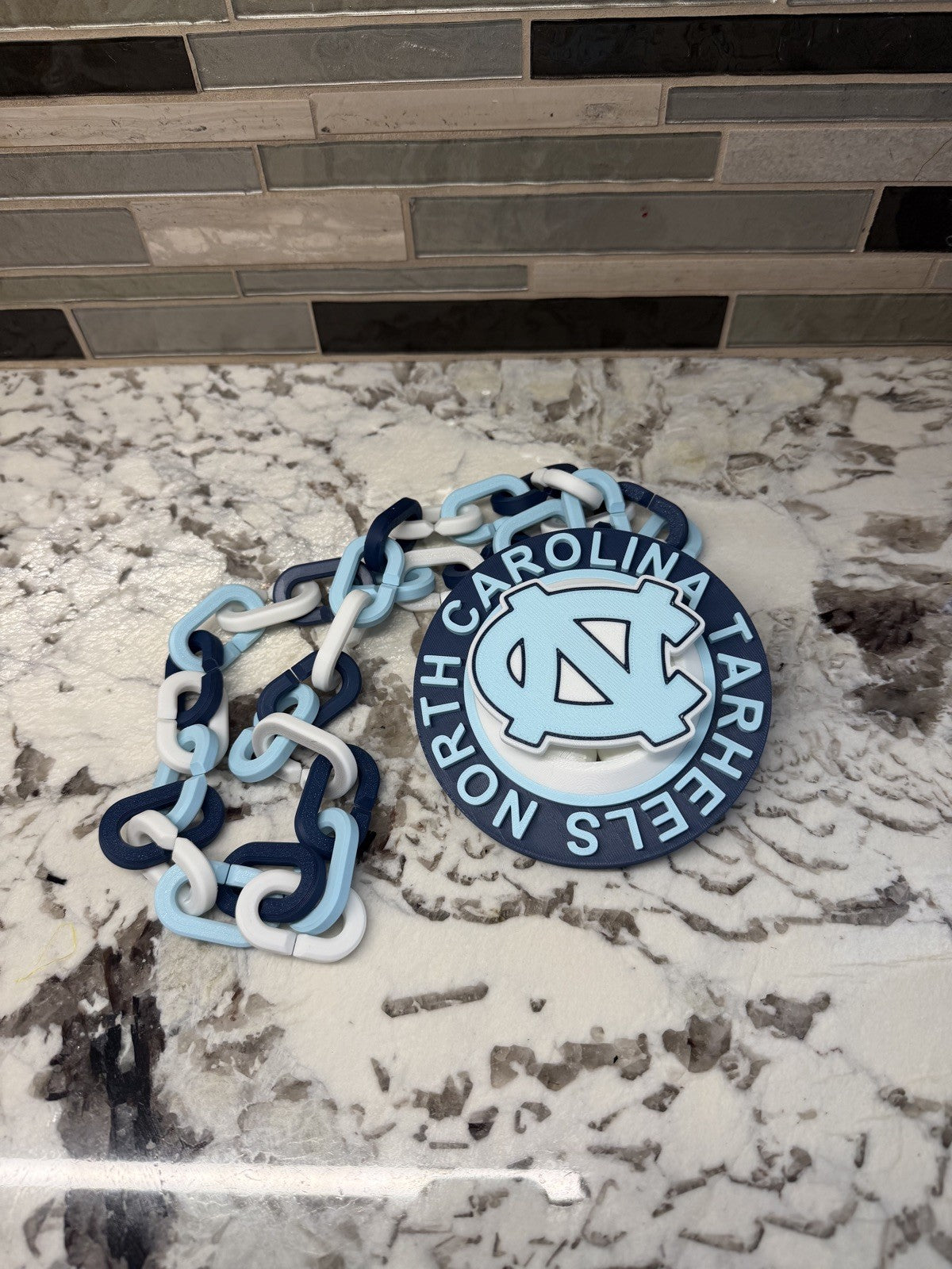 North Carolina Tarheels Spinner Turnover Chain | 4.75” Pendant | 36” Chain | UNC